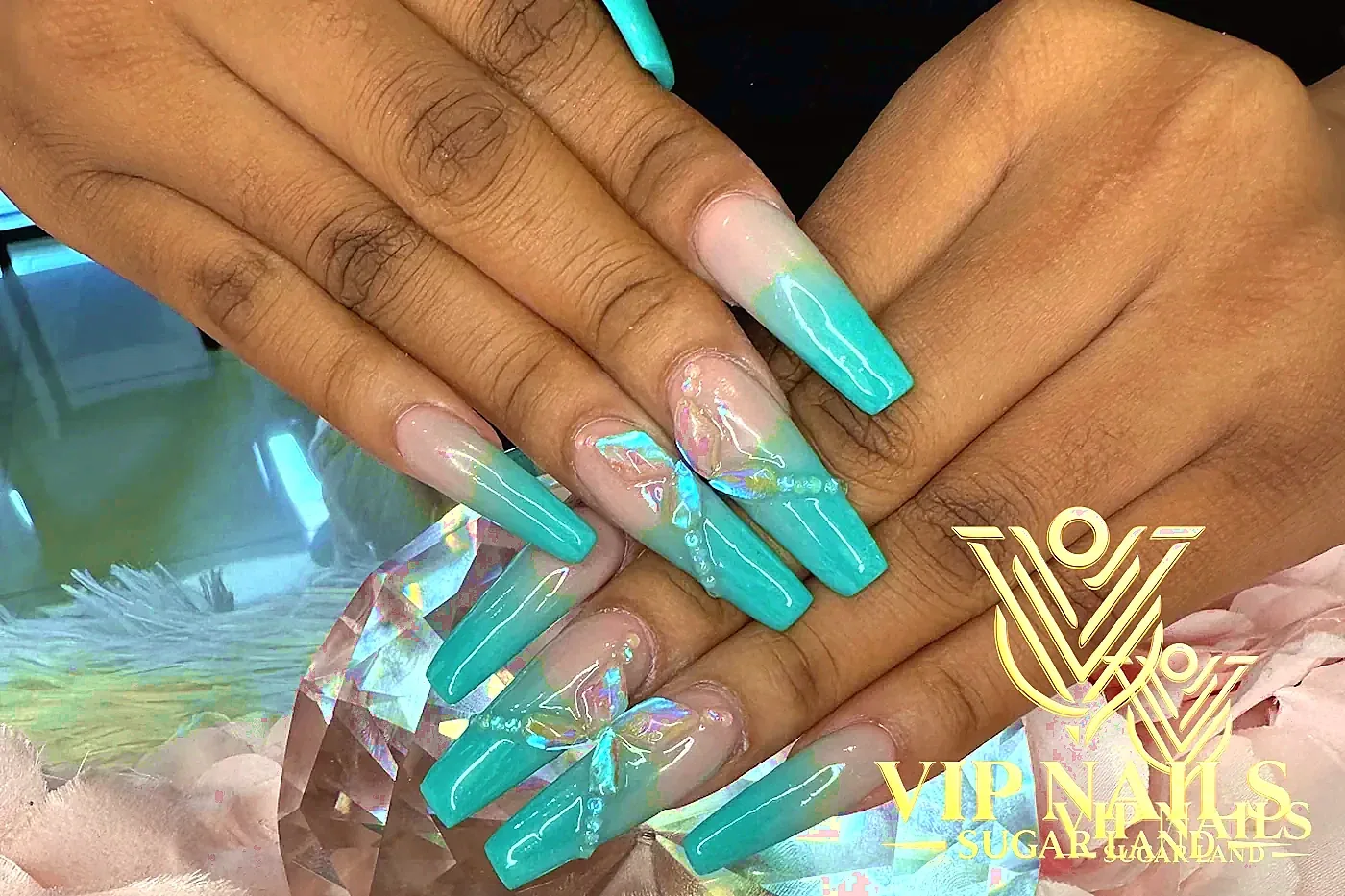 XL teal ombré nails with iridescent 3D butterflies and crystal prop