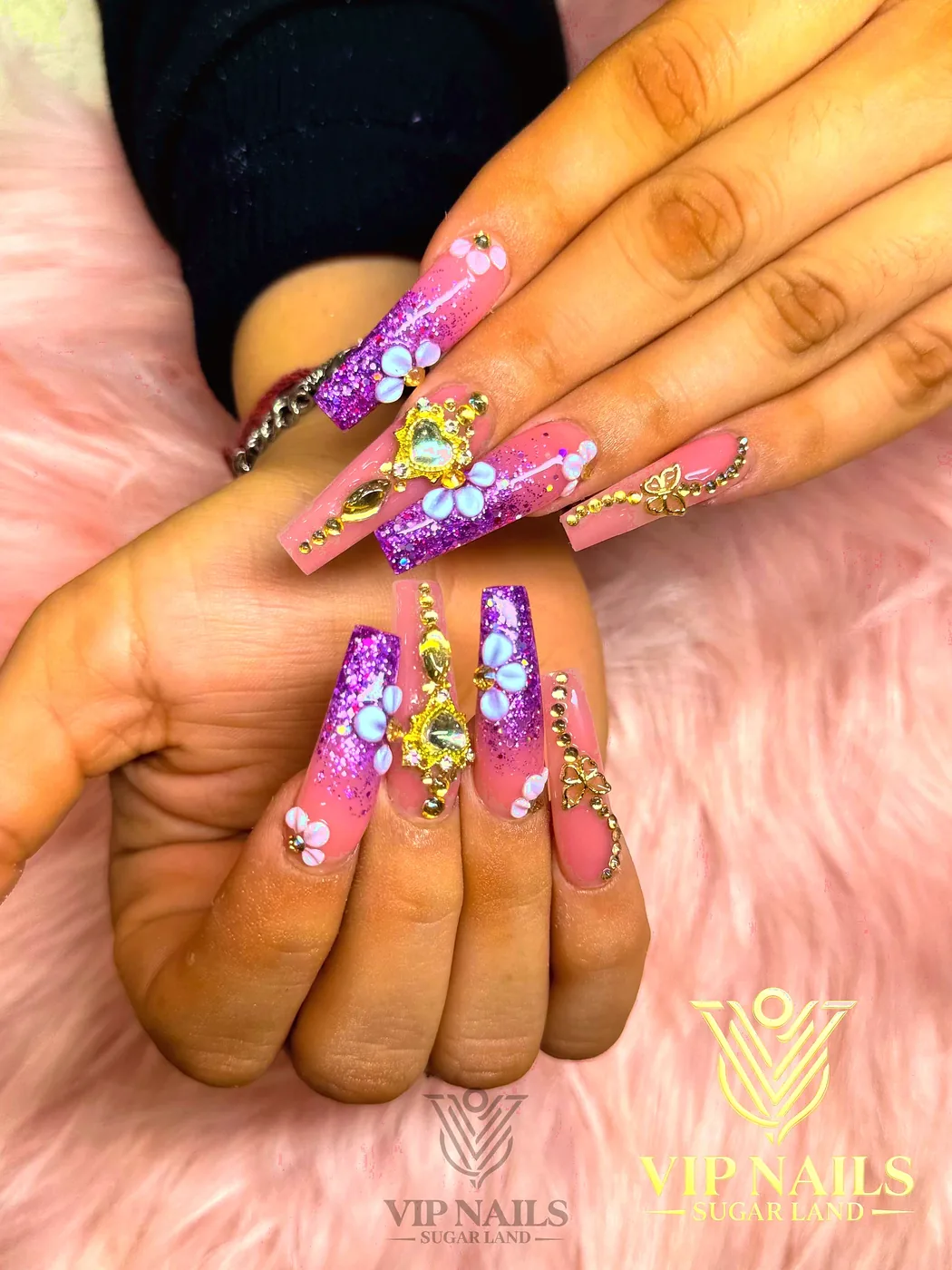 XL purple glitter coffin nails with 3D florals and gold charms