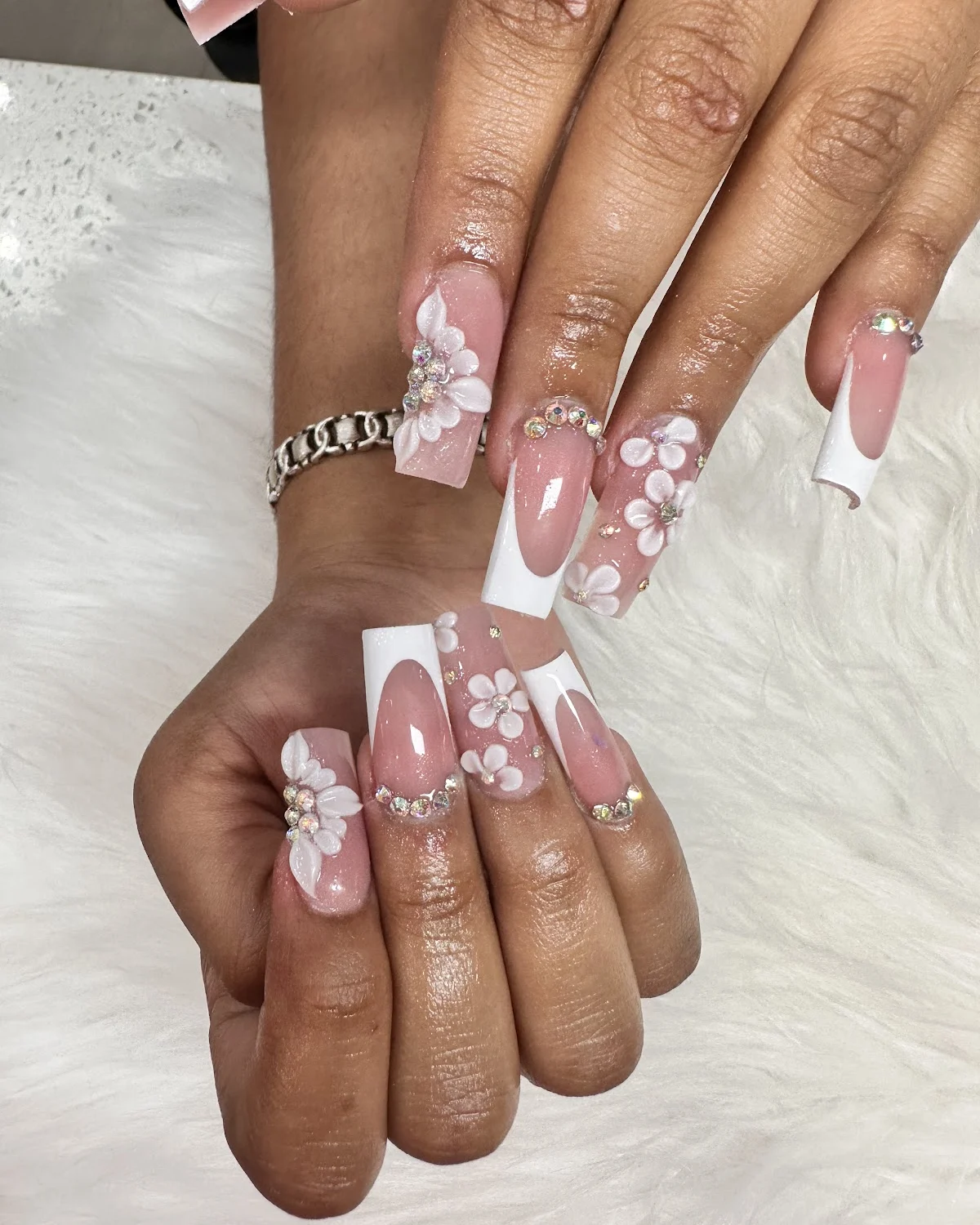 White French tips with 3D flowers and crystals by VIP Nails Sugar Land